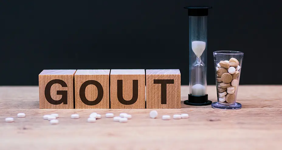 Wood lettering spelling out “gout”